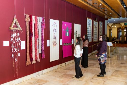 People viewing a Fountain Court exhibition