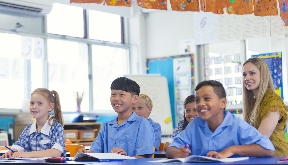 children and teacher in a classroom