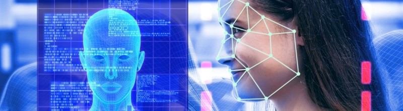 Facial recognition nodes overlaid on woman's smiling face next to a digital model of her face