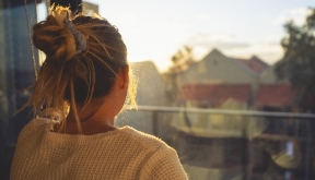 Person looking out of a window